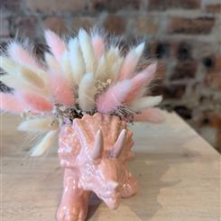 Pink ceramic Triceratops with dried bunny tails